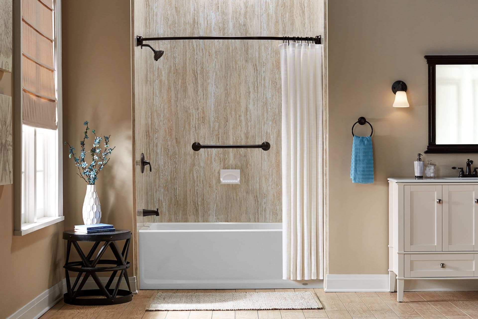 A combination shower bathtub with beige textured walls, black fixtures, and horizontal grab bar.