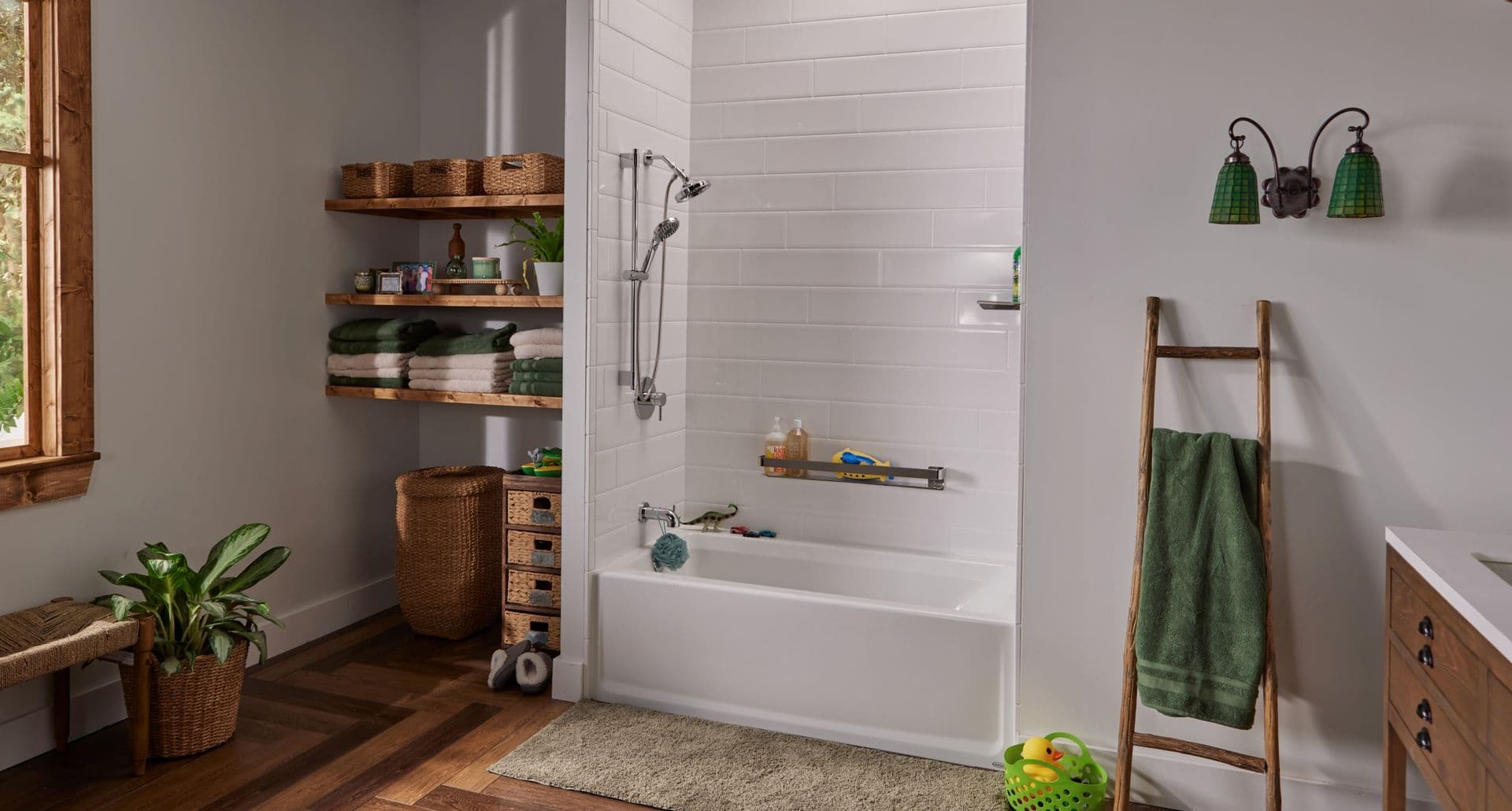 A combination shower bathtub with white horizontal subway tile walls.