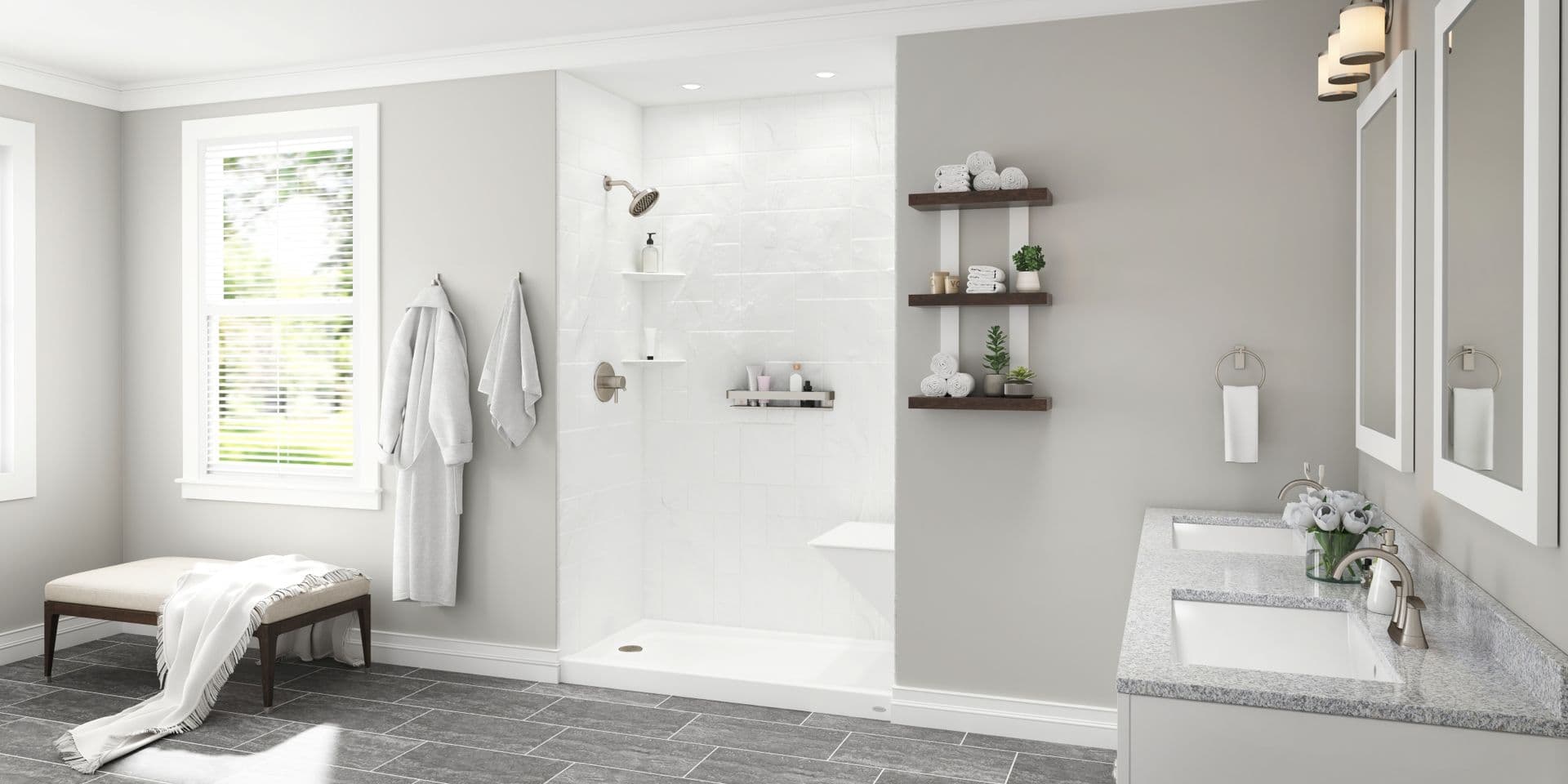 A white walk-in shower with a bench in a gray bathroom.